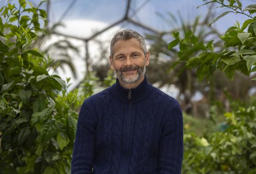 A headshot of Si Bellamy taken in the Eden Project biomes